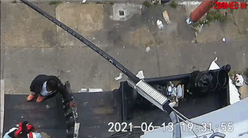 Security camera video screenshot of victim and defendant